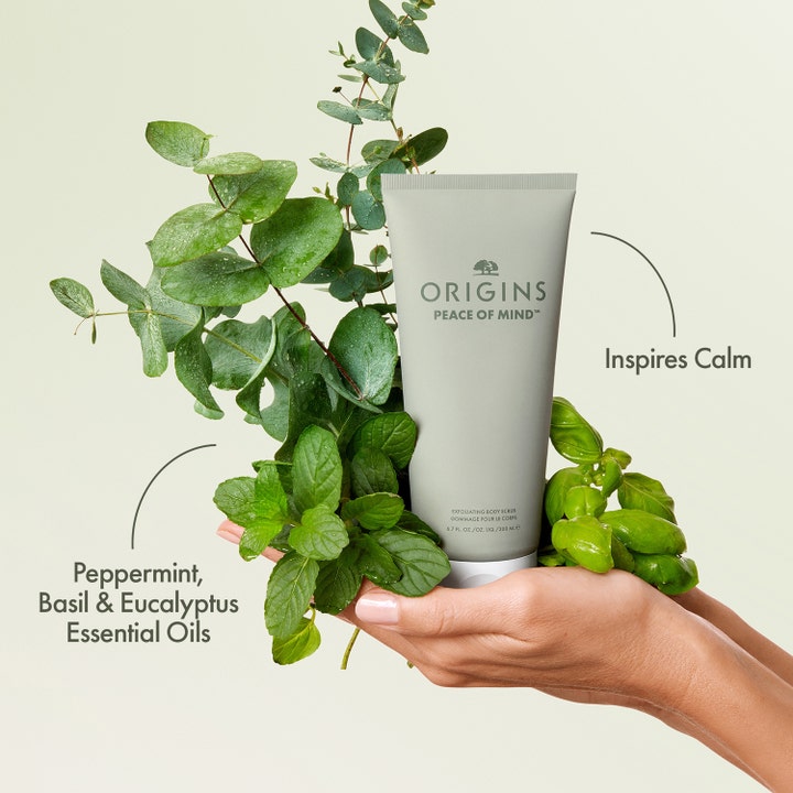 Origins Peace Of Mind Exfoliating Body Scrub 200 ml kroppsskrubb ger lugn med eukalyptus och örter i en grågrön tub.