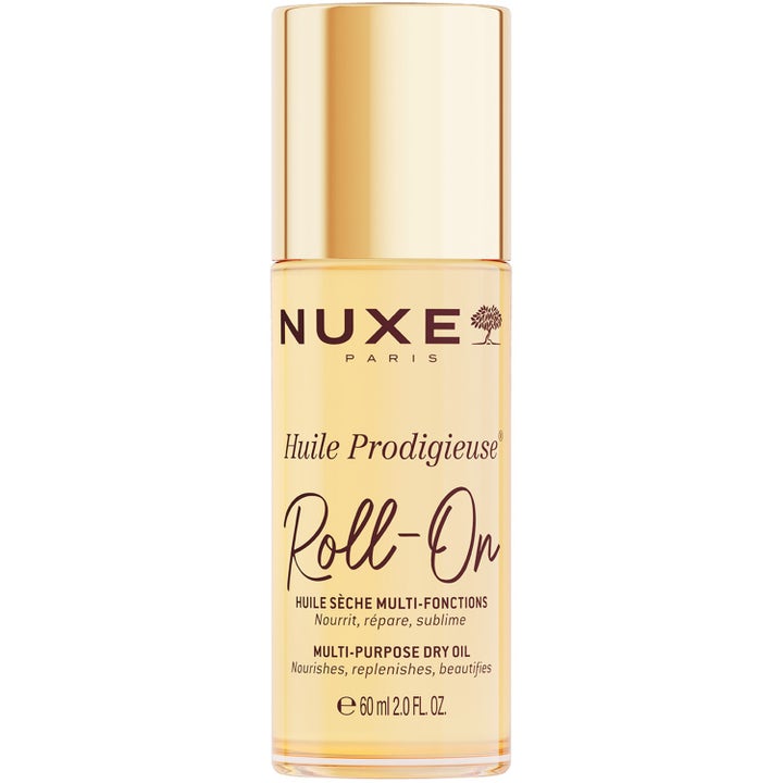 Nuxe Huile Prodigieuse Roll-On 60 ml närande skönhetsolja som ger lyster i en smal glasflaska med lyxig guldkork.