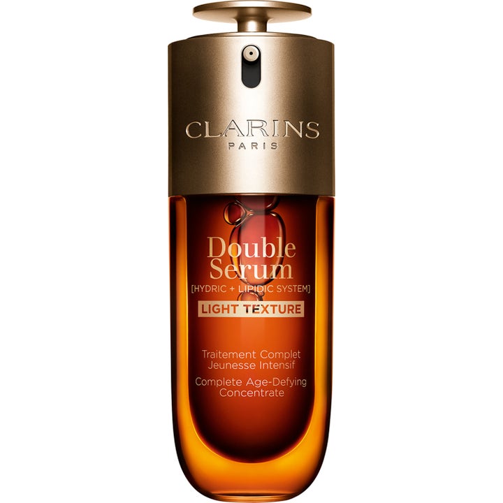 Clarins Double Serum Light Texture 50ml anti age koncentrat hudvård i bärnstensfärgad flaska med guldpump.