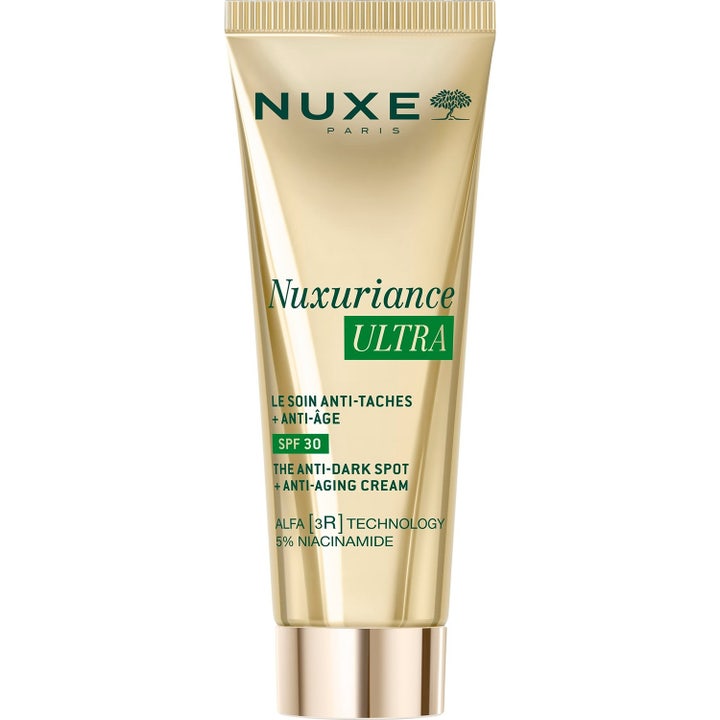Nuxe Nuxuriance Ultra 50ml ansiktskräm mot mörka fläckar i en elegant guldfärgad tub med SPF 30 och guldlock