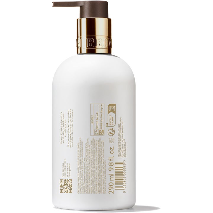 Molton Brown Milk Musk Body Lotion 300 ml intensivt återfuktande body lotion i vit flaska med guldpump sedd bakifrån