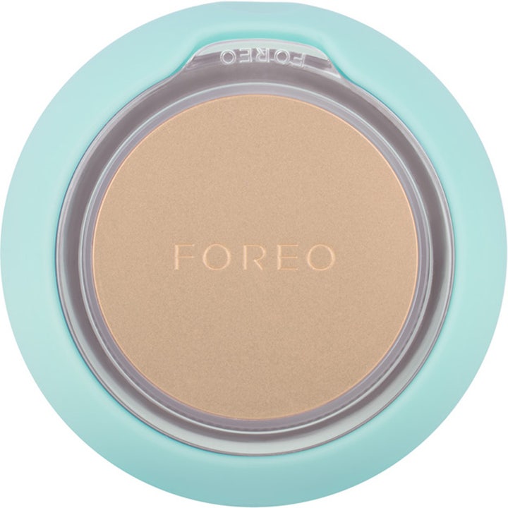 FOREO UFO 2 Mint beautytech maskenhet för ansiktsbehandling sedd underifrån med guldfärgad platta.