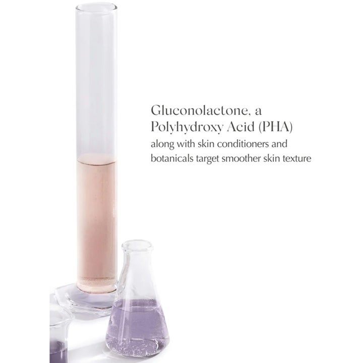 Exuviance Gentle Cream Cleanser 212 ml med PHA och botaniska extrakt visas i laboratorieglas för jämnare hy.
