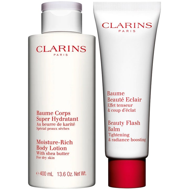 Clarins Moisture-Rich Body Lotion 400ml och Beauty Flash Balm ger fuktgivande hudglöd i vit flaska och tub med rött lock