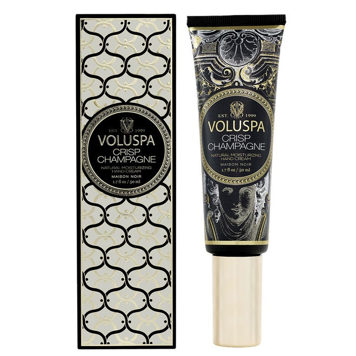 Voluspa Crisp Champagne 50 ml återfuktande handkräm i svart tub och ask med dekorativa mönster i guld