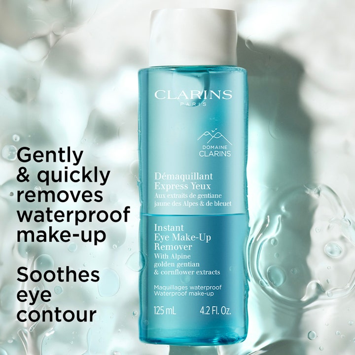 Clarins Instant Eye Make-Up Remover 125 ml effektiv sminkborttagning vattenfast mascara i blå flaska bland vattenstänk