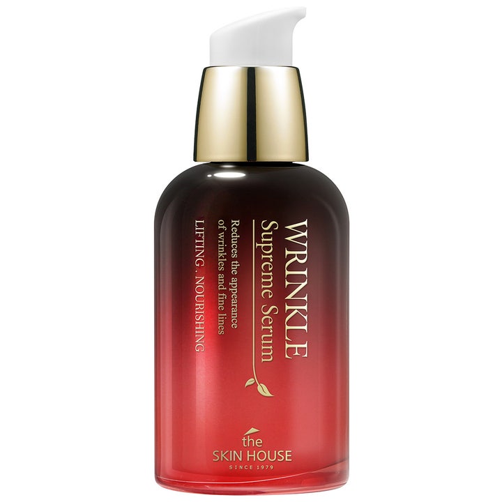 The Skin House Wrinkle Supreme Serum anti-rynk serum lyftande effekt i röd gradientflaska med gulddetaljer och vit pump