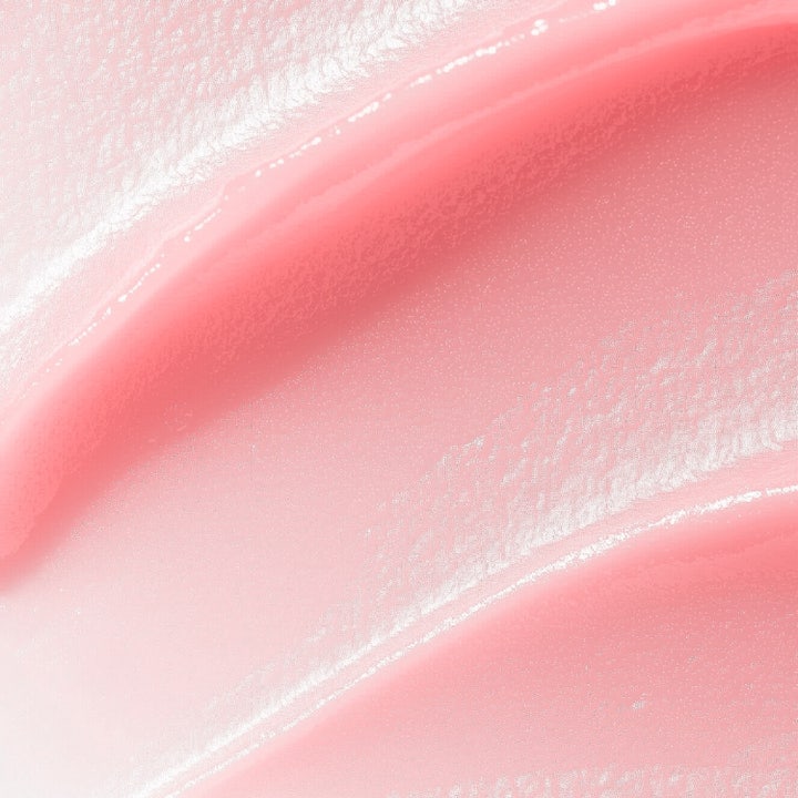 MANTLE The Rose Balm 15 ml återfuktande spot treatment visas som en mjuk och glansig rosa krämig textur