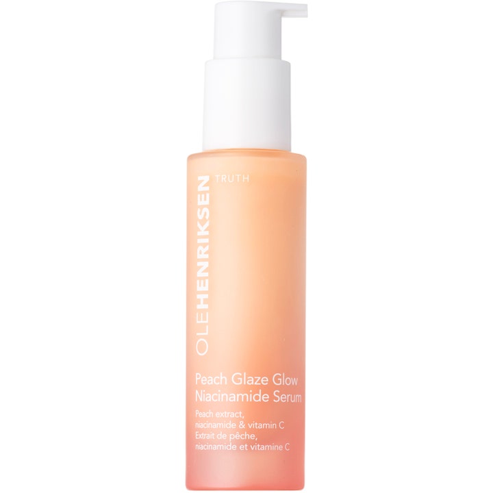 OLEHENRIKSEN Peach Glaze Glow Niacinamide Serum lystergivande ansiktsserum i frostad persikofärgad flaska med vit pump