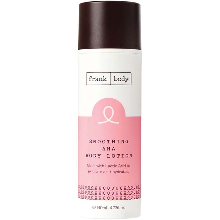 Frank Body Smoothing AHA Body Lotion 140ml exfolierande kroppslotion i vit flaska med rosa detaljer och brunt lock.
