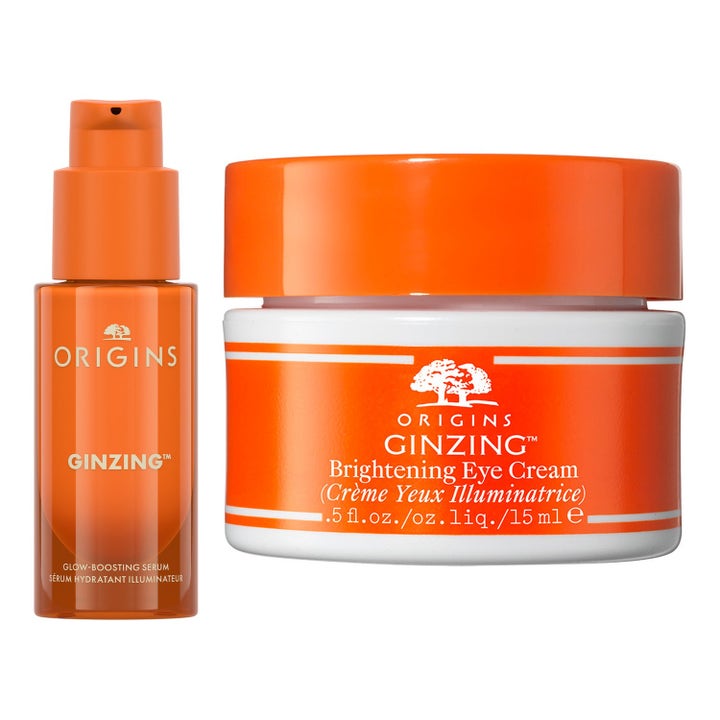 Origins GinZing lystergivande serum och uppljusande ögonkräm 15 ml i orange pumpflaska och vit burk med orange lock