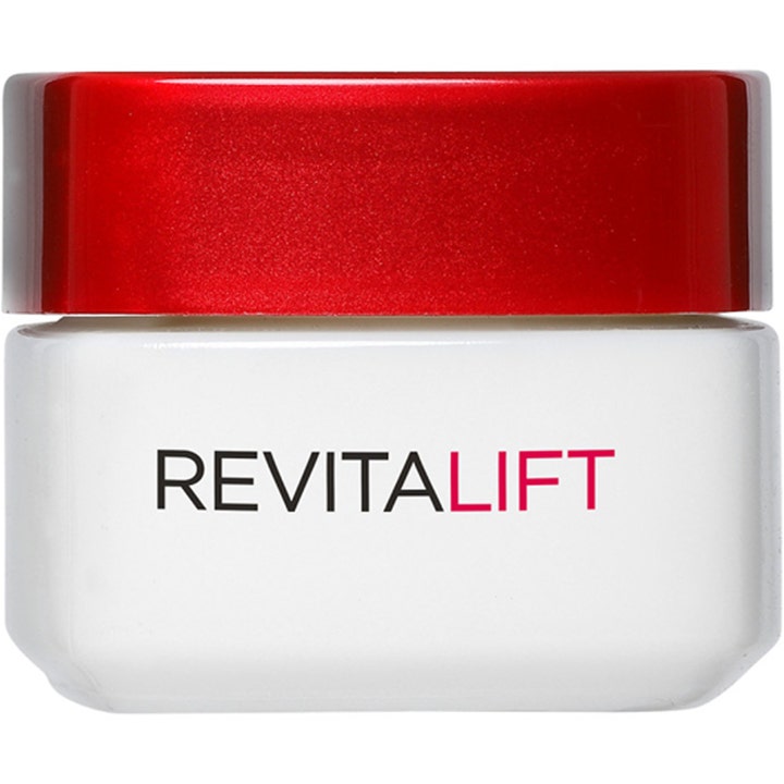 L'Oréal Paris Revitalift 15 ml antirynk ögonkräm i en vit glasburk med ett glansigt rött lock.