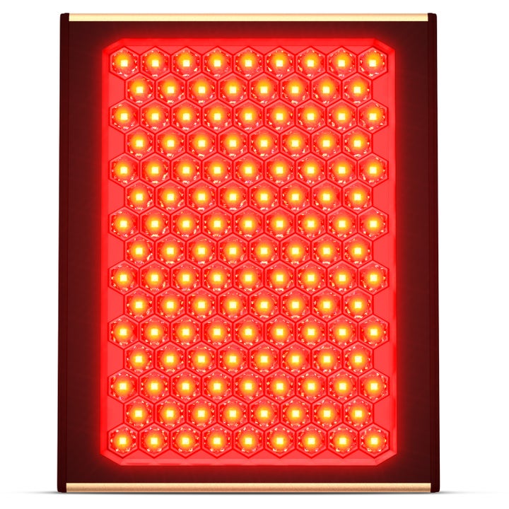 Rödljusterapi Panel för föryngrande hudvård med lysande röda LED-lampor i ett hexagonalt mönster.
