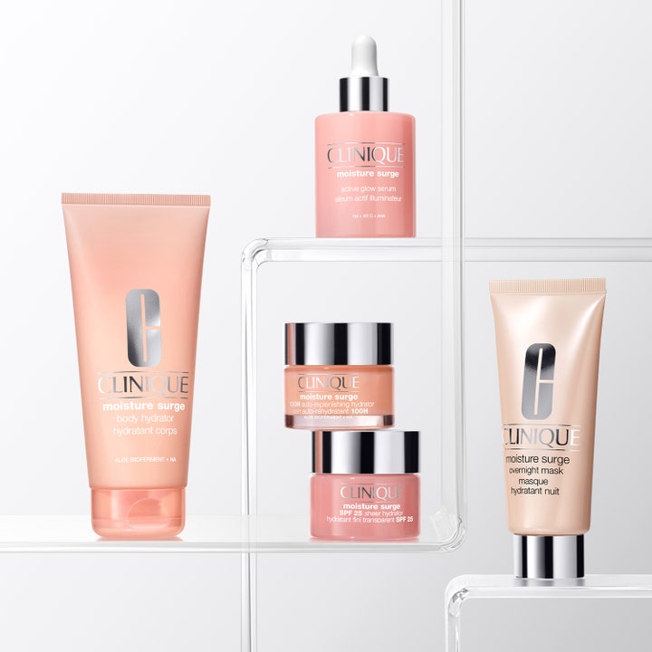 Clinique Moisture Surge Body Hydrator 200 ml återfuktande aloe kroppskräm för torr hud i persikofärgad tub på hylla.