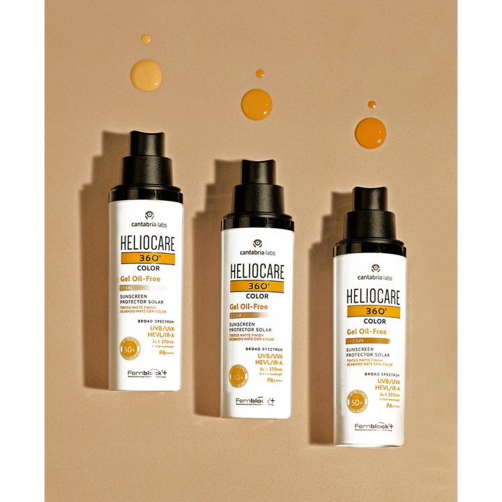 Heliocare Gel Bronze solskydd 50 ml färgat solskydd ansikte spf 50 i vita flaskor med droppar av produkten.