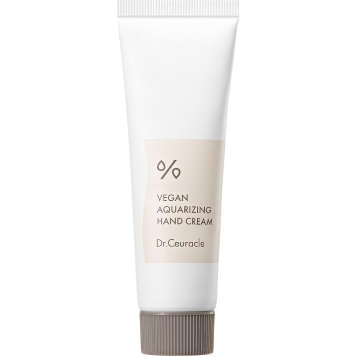 Dr. Ceuracle Vegan Aquarizing Hand Cream närande handkräm i vit tub med beige etikett och räfflat brunt lock.