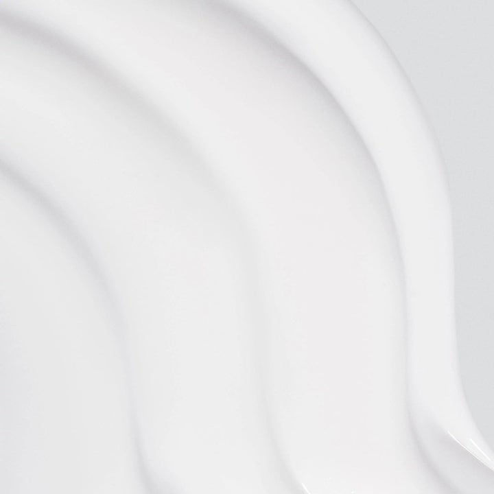 Dermalogica AGE smart Duo Skin Resurfacing Cleanser exfolierande rengöring med vit krämig konsistens i mjuka vågor.