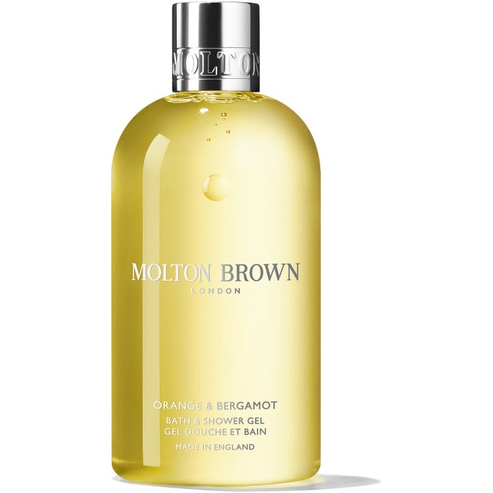 Molton Brown Orange & Bergamot 300 ml lyxig duschtvål med citrondoft i en gul genomskinlig flaska med silverkork