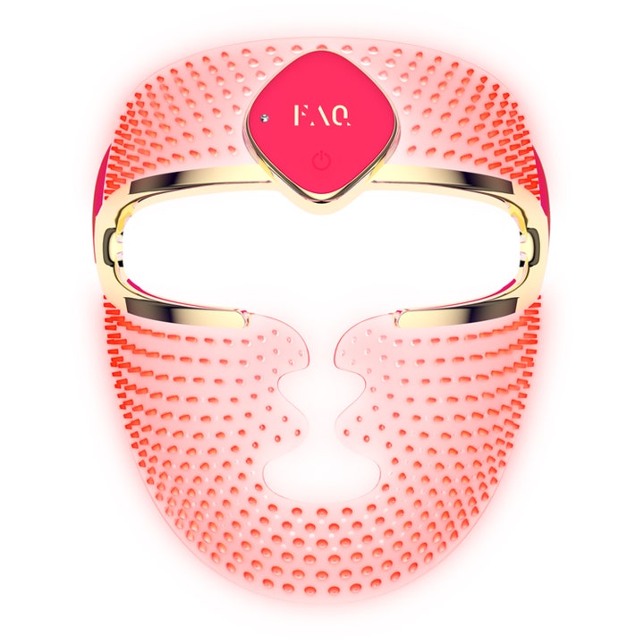 FAQ Swiss FAQ 202 led ansiktsmask ger lyster i en rosa perforerad silikonmask med lyxiga gulddetaljer.
