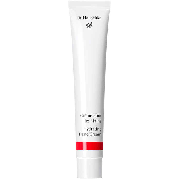 Dr. Hauschka Hydrating Hand Cream återfuktande handkräm som ger mjuk hud i en vit tub med röd rand