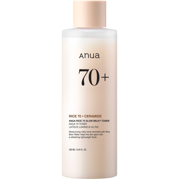 Anua Rice 70 Glow Milky Toner 250 ml återfuktande ansiktsvatten som ger lyster i frostad flaska med persikofärgat lock