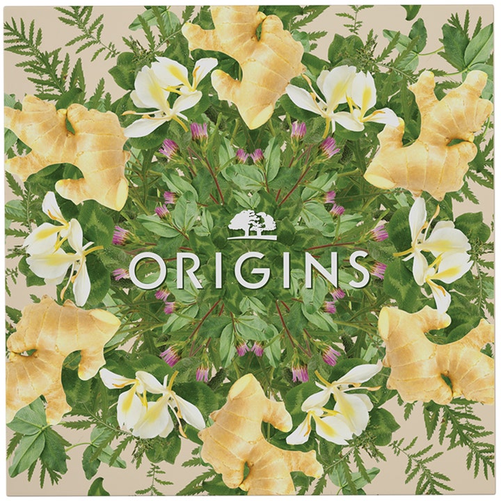 Origins The Glow-Boosting Collection 70 ml citrus hudvårds kit med ett botaniskt mönster av ingefära och blommor.