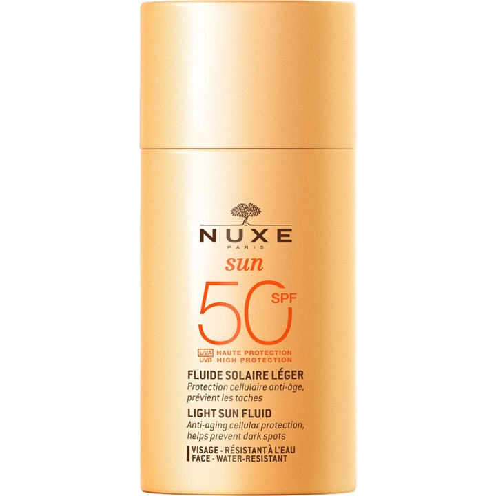 Nuxe Sun Light Sun Fluid SPF 50 50ml solskydd som ger anti-age skydd i en persikofärgad flaska med matchande lock