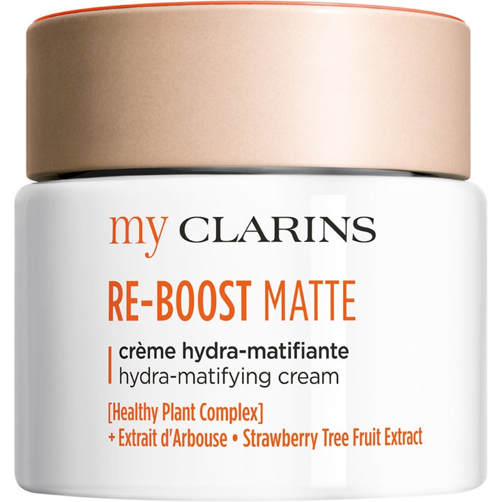 My Clarins Re-Boost Matte återfuktande ansiktskräm i vit burk med persikofärgat lock som ger en matt finish.