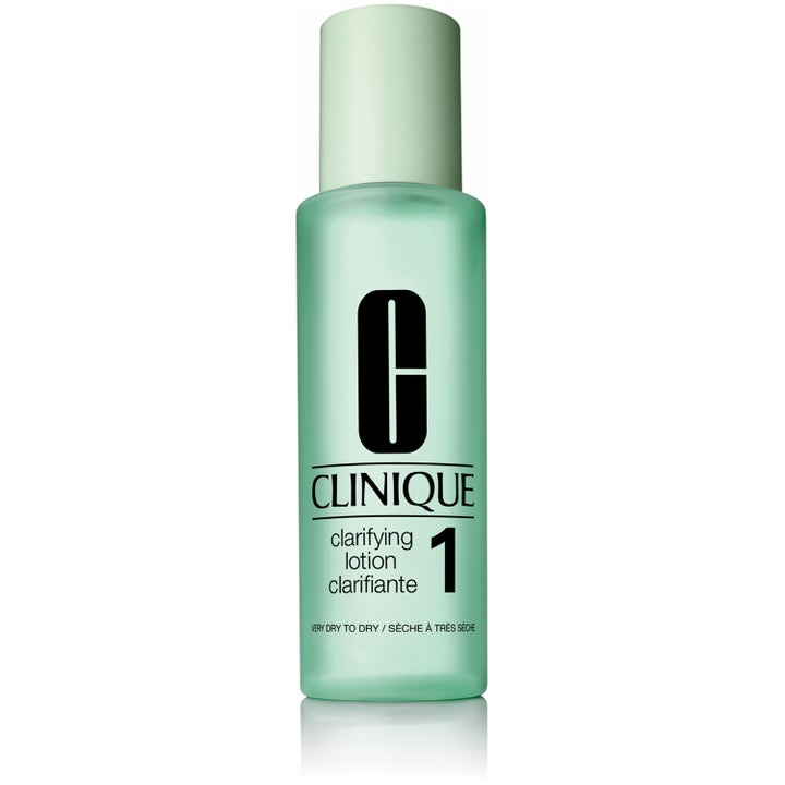 Clinique Clarifying Lotion 1 exfolierande ansiktsvatten för torr hy i en mintgrön frostad flaska med grönt lock.