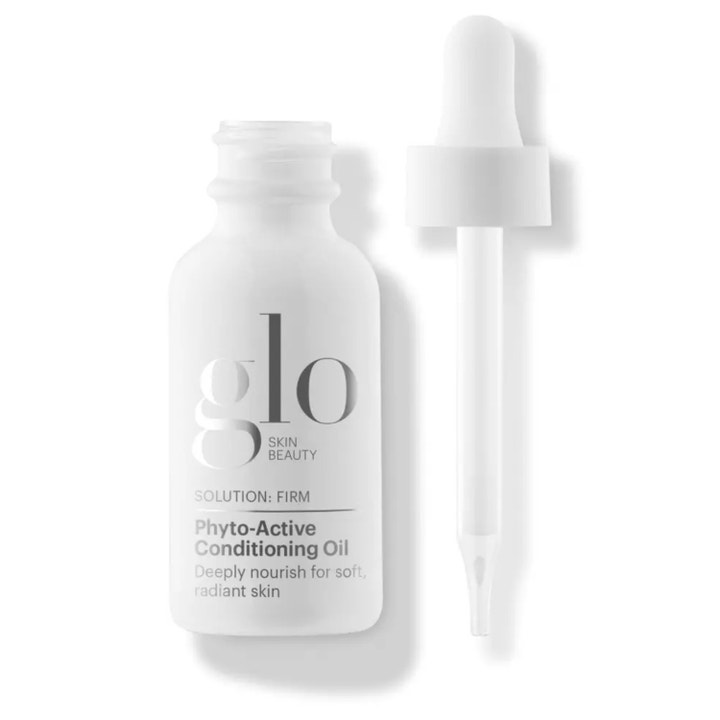 Glo Skin Beauty Phyto-Active Conditioning Oil ger näring och lyster i en vit frostad glasflaska med vit pipett.