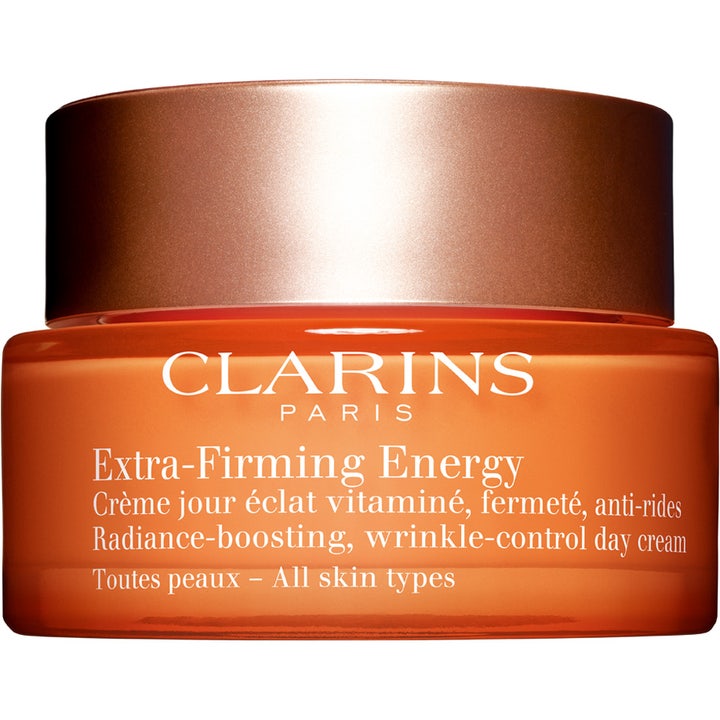 Clarins Extra-Firming Energy anti-age kräm för fasthet och utslätning av rynkor i en orange glasburk med bronslock.