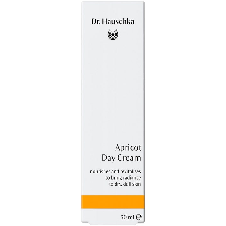 Dr. Hauschka Apricot Day Cream 30 ml lystergivande dagkräm i vit ytterförpackning med en orange rand.