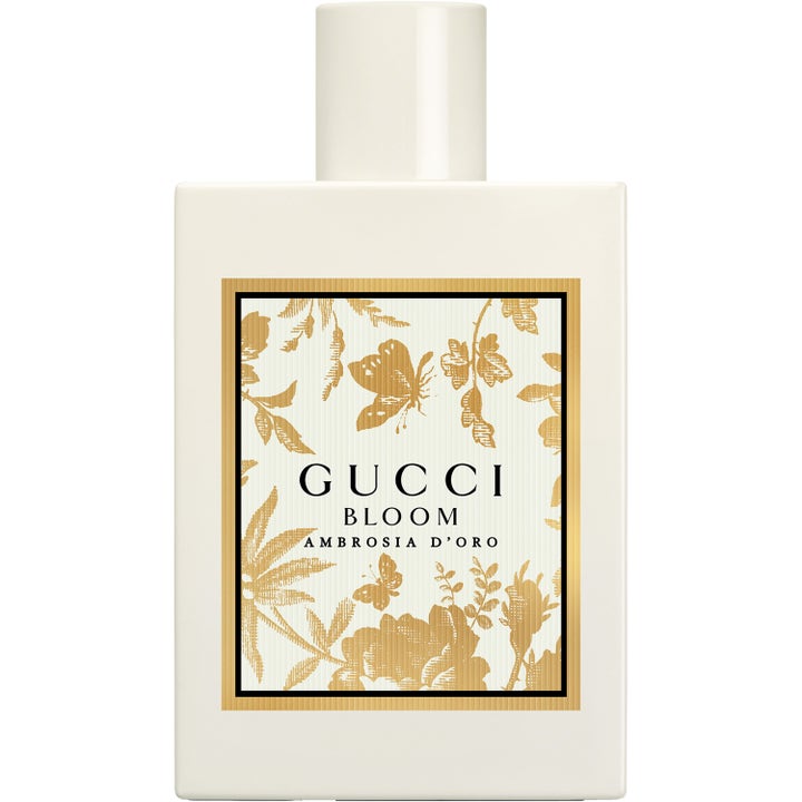 Gucci Bloom Ambrosia d'Oro 100 ml blommig parfym i vit flaska med guldmönstrad etikett och vitt lock