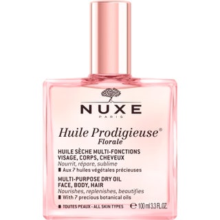 Nuxe Huile Prodigieuse Florale 100 ml vårdande ansiktsolja torr hud och hårolja spray i en rosa glasflaska med lös kork