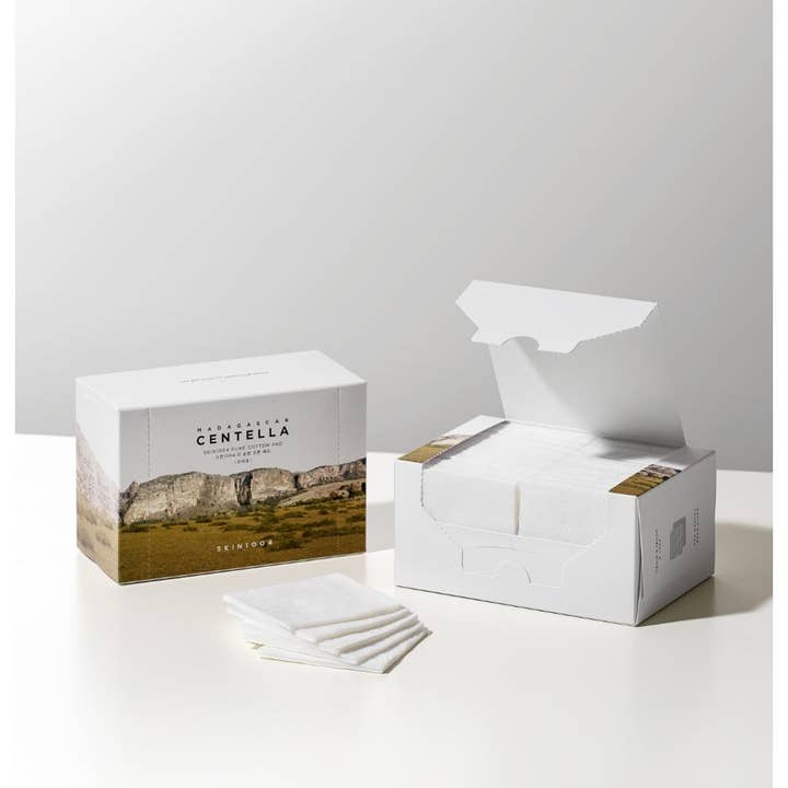 SKIN1004 Madagascar Centella Pure Cotton Pad ansiktsrengöring bomullspads i vit box med vackert landskapsmotiv