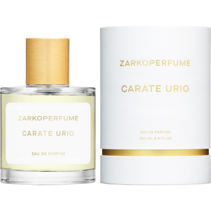 Zarkoperfume Carate Urio 100ml unisexparfym i glasflaska med gulddetaljer på varm stenyta