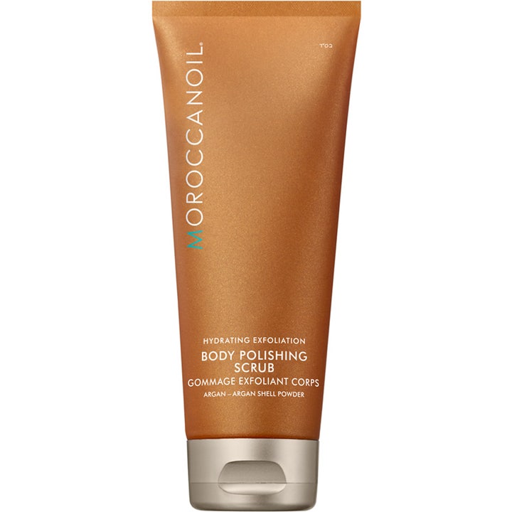 Moroccanoil Body Polishing Scrub exfolierande kroppsskrubb med arganolja i en skimrande bronsfärgad tub med silverlock.