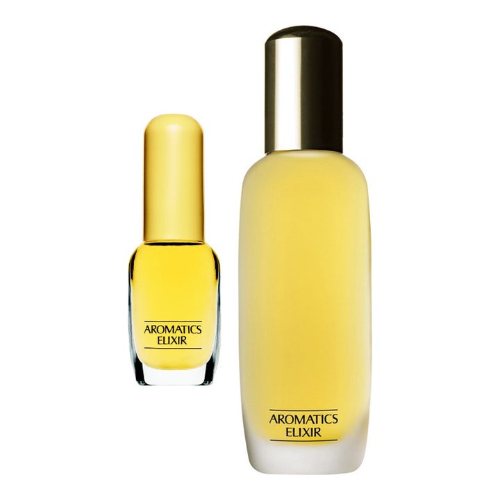 Clinique Aromatics Elixir parfym i två flaskor av frostat och klart glas med gul vätska och eleganta guldfärgade lock