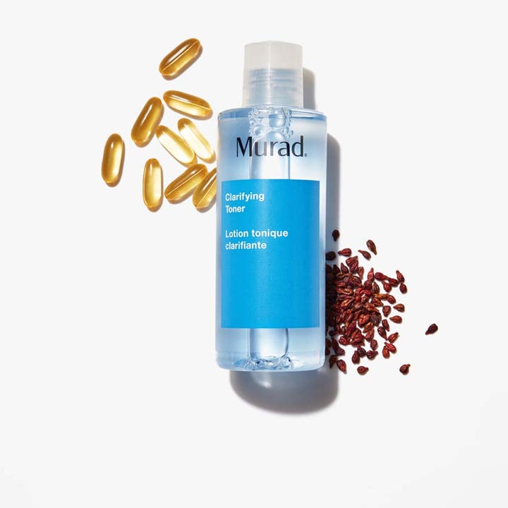 Murad Clarifying Toner 180 ml djuprengörande ansiktsvatten omgiven av gyllene kapslar och mörkröda frön