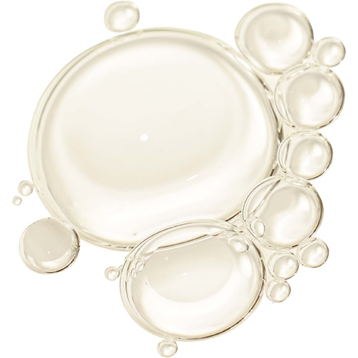 Erborian Skin Therapy Night Oil Serum 30 ml nattserum visar en närbild på en textur med klara, runda oljedroppar.