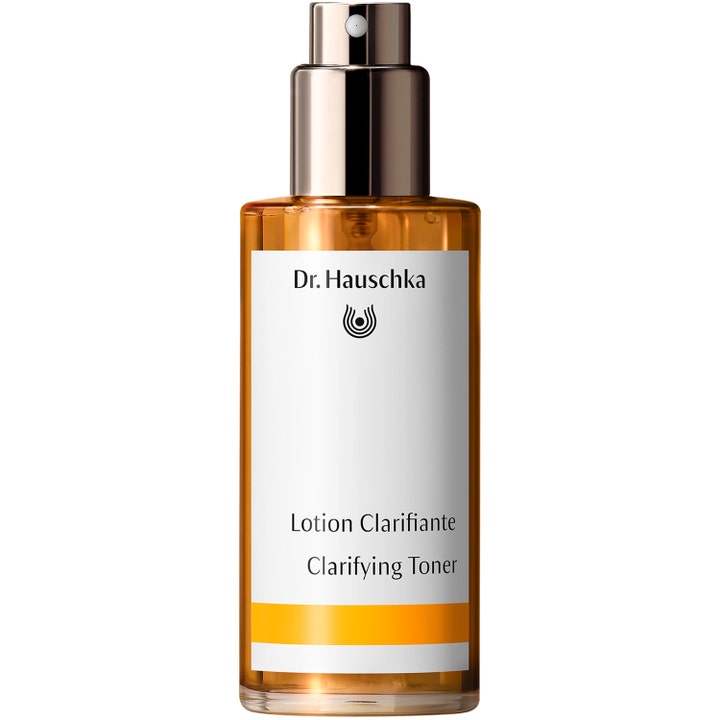 Dr. Hauschka Clarifying Toner 100 ml ansiktsvatten mot oren hy i en bärnstensfärgad glasflaska med silverpump.