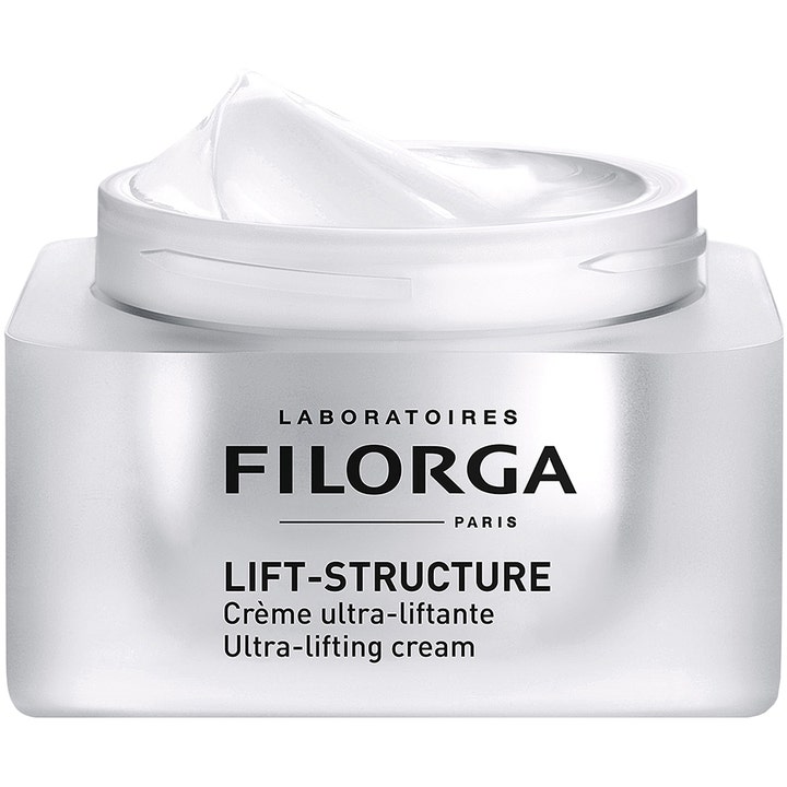 Filorga Lift-Structure 50 ml föryngrande kräm i öppen silverburk visar en krämig vit textur för ansiktslyft.