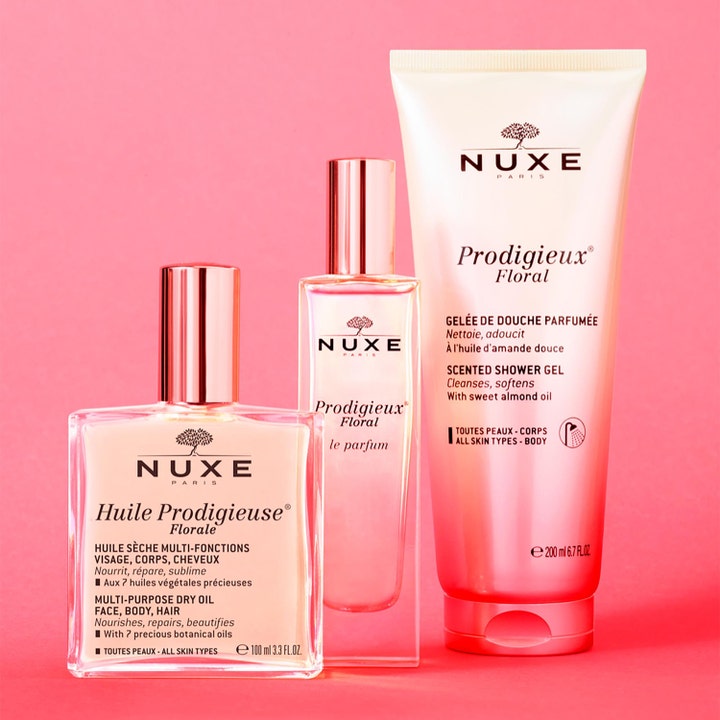 Nuxe Huile Prodigieuse Floral 100 ml närande ansiktsolja torr hud i glasflaska intill matchande parfym och duschgel.
