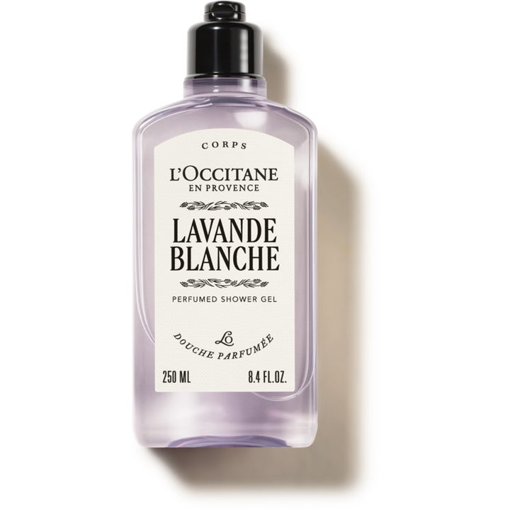L'Occitane Lavande Blanche 250 ml väldoftande duschgel i genomskinlig flaska med lila formula och svart lock