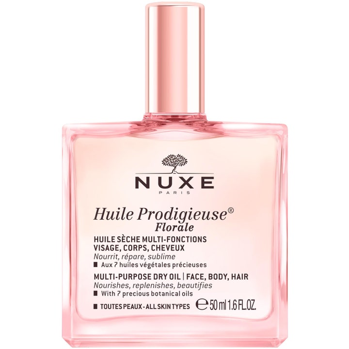 Nuxe Huile Prodigieuse Florale 50 ml torrolja som ger näring i en rosa glasflaska med glänsande roséguldfärgad kork