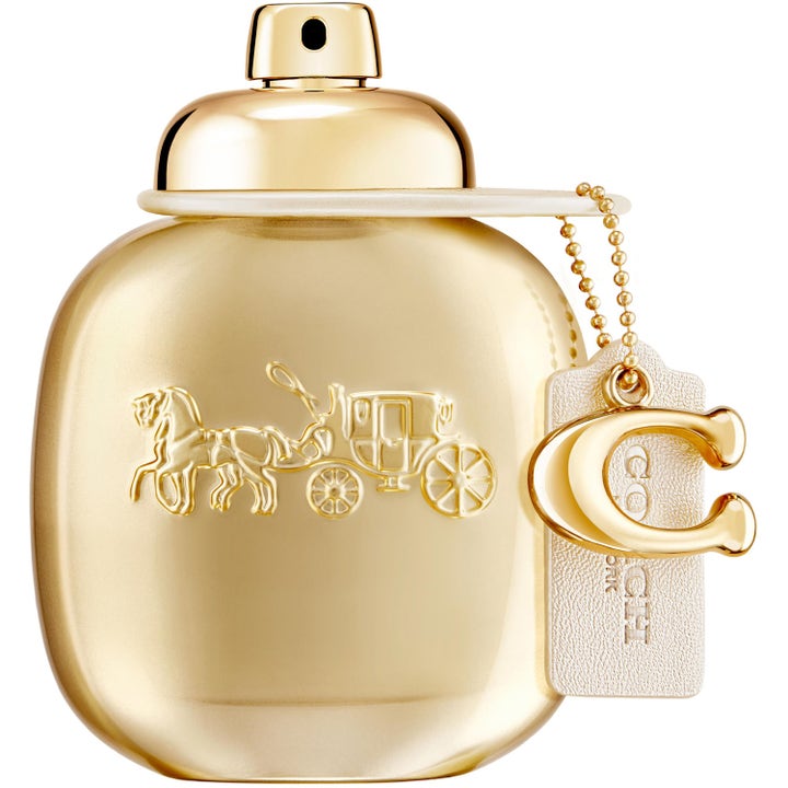 Coach Woman Gold EDP 50ml lyxig parfym i guldfärgad flaska med präglad hästlogga och ett guldigt C-hänge