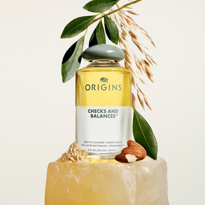 Origins Checks & Balances 150 ml milky oil cleanser ansikte med mandel och havre i en tvåfasflaska med grönt lock