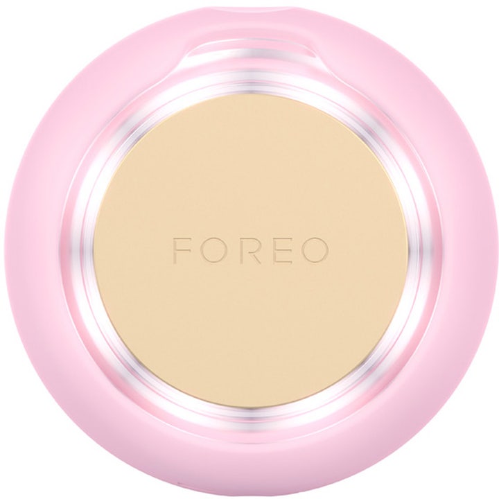 FOREO UFO 3 mini Pearl Pink 1 st ansiktsbehandling visar en rund rosa silikonenhet med en beige platta i mitten.