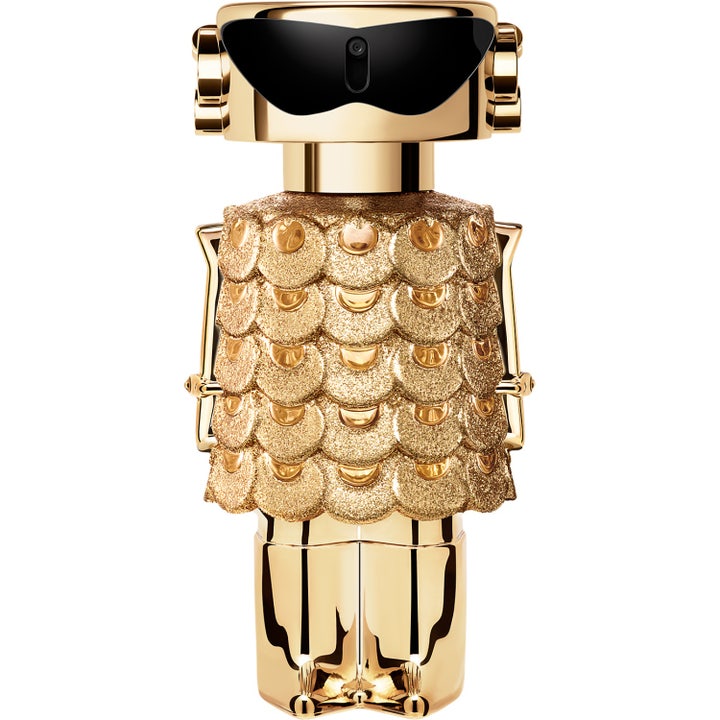 Rabanne Fame Intense 50 ml eau de parfum dam är en intensiv parfym i guldflaska formad som en robot med glittrande klänning