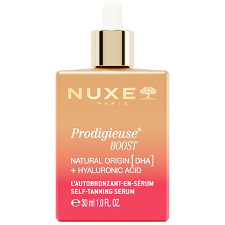 Nuxe Prodigieuse Boost 30 ml hyaluronsyra ansiktsserum självbrunande i en rosa-orange flaska med vit dropper